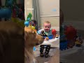 Golden retriever unimpressed by baby&#39;s hilarious antics