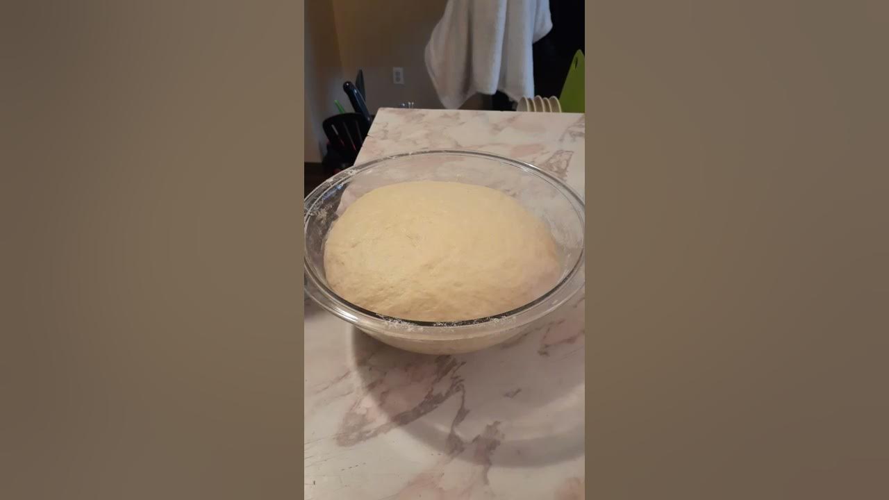 Punching down and kneading the dough halfway through the bulk rise