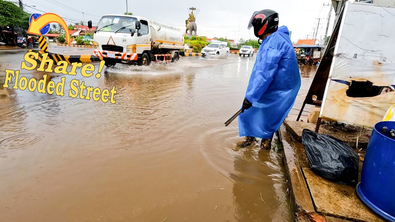 Unclogging Drains Street After A Heavy Rain And Flooded Road Unclogging ...