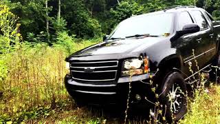 Lifted Chevy Avalanche Camping