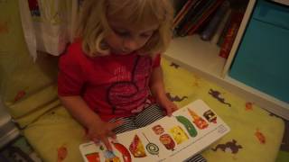Clara Reading The Very Hungry Caterpillar