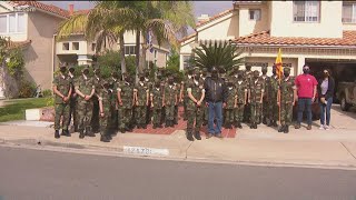 'Young Marines' show appreciation to veterans with flag poles and American flags