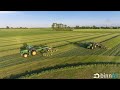 Kastelijn en hendriks aan het inkuilen van gras