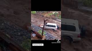 Impatient driver takes Toyota Landcruiser for a swim during Jamaica Flood rains.