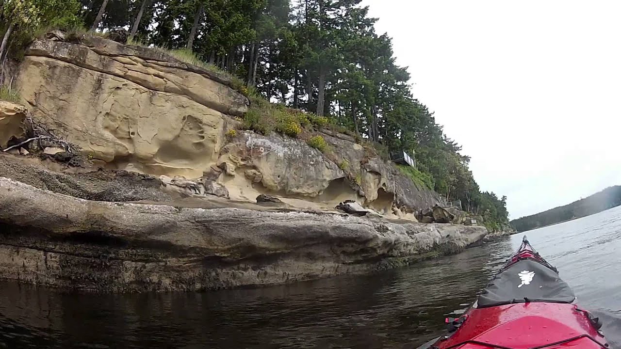 Kayaking passed Gabriola island Malaspina gallery sandstone cliffs