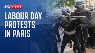 Tear gas fired at Labour day protests in Paris