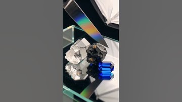 Extreme slow-motion knife slices through obsidian, quartz, sapphire, emerald, jade, and diamond.