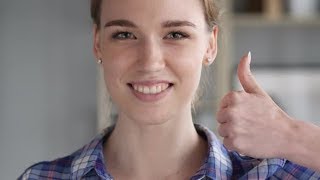 Thumbs Up by Young Woman at Work, Looking at Camera | Stock Footage - Videohive Thumbs Up by Young Woman at Work, Looking at Camera | Stock Footage - Videohive