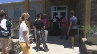Protesters gather at Greenwood restaurant