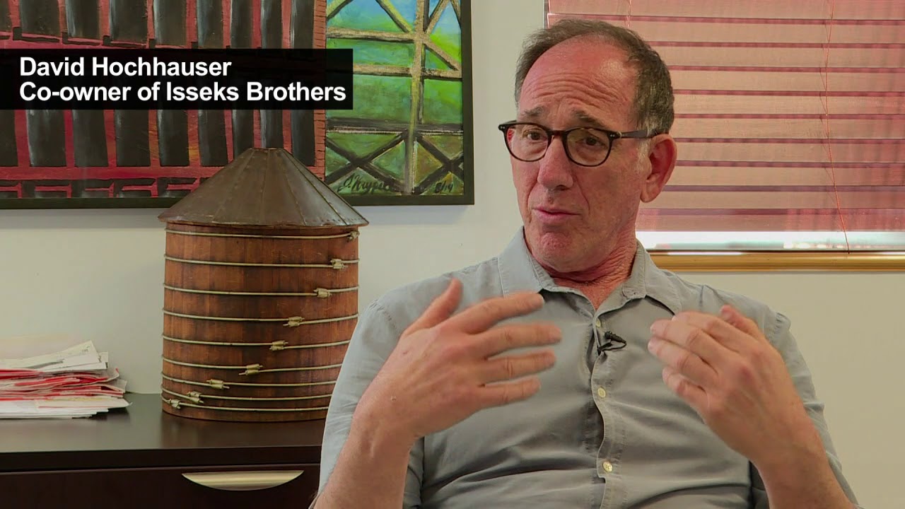 On New York's rooftops, old-style wooden water tanks hang tough