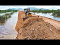 Fantastic expert operator komatsu bulldozer pushes cutting the ground in project landfiling up road