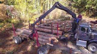 International HX Self loader log truck loading, 4K  drone view
