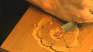 In this video, professional woodcarver, Mary May, shows the basic woodcarving techniques by carving a simpler flower with 