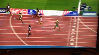 Blessing Okagbare gives Mary Onyali a high five after Commonwealth sprint double