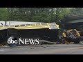 2 killed, several injured after school bus collides with dump truck