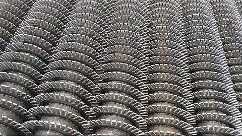 How are serrated finned tubes made?-Datang finned tube