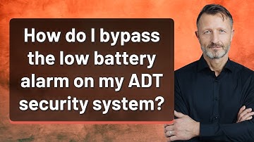How do I bypass the low battery alarm on my ADT security system?