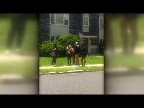 Four high school students help elderly man