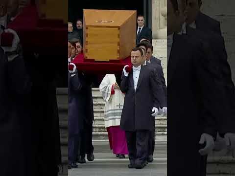 Pope Benedict's coffin laid before altar