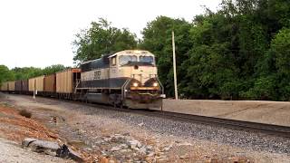 Lots of long freight trains roll through a busy junction!