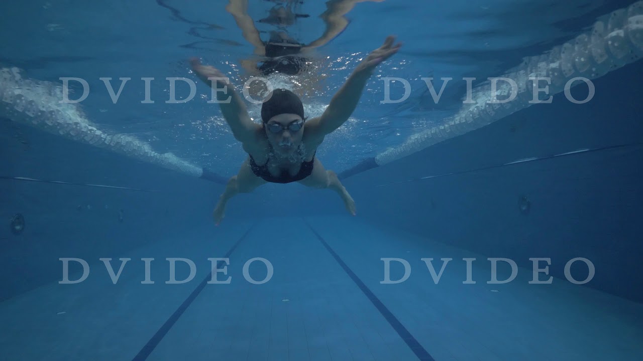 Woman swimmer swimming breaststroke in waterpool underwater view - YouTube