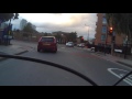 Truck pulls an interesting u-turn at traffic lights.