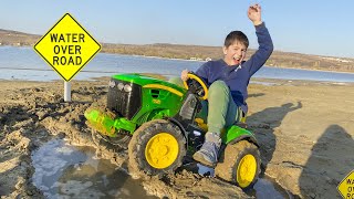 Rescuing excavator from water with tractor power wheel. Darius learns traffic signs