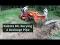 Kubota BX- Burying a corrugated drainage pipe