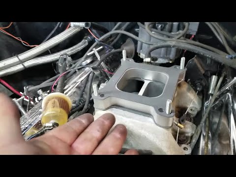Video: Hoe monteer je een carburateur spacer?