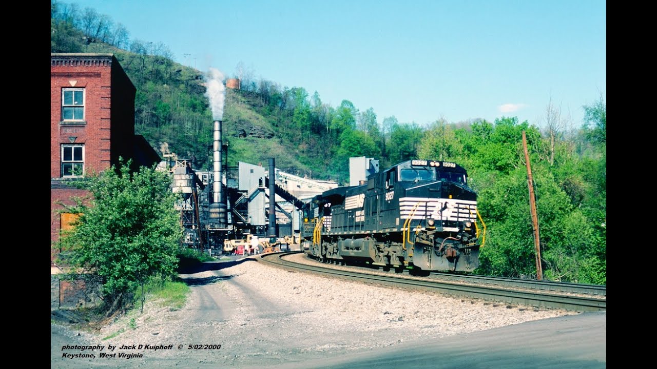 NORFOLK SOUTHERN action at KEYSTONE, WV. as a CAT WHEEL LOADER shoves loaded hoppers. 5/2000