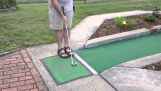 One handed windmill hole-in-one