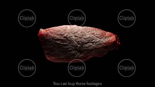 TIME-LAPSE: Defrost Of A Raw Beef Steak Piece On A Black Background