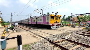 Single Windshield Colorful Emu Local Train Furiously Crossing Over Railgate