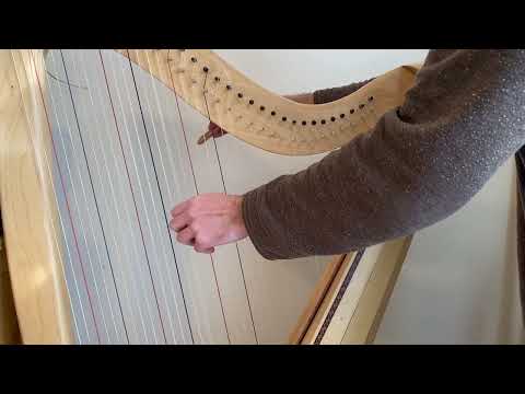 How to Pre-Stretch a New Harp String lesson thumbnail from the official Strings of Hope YouTube channel.
