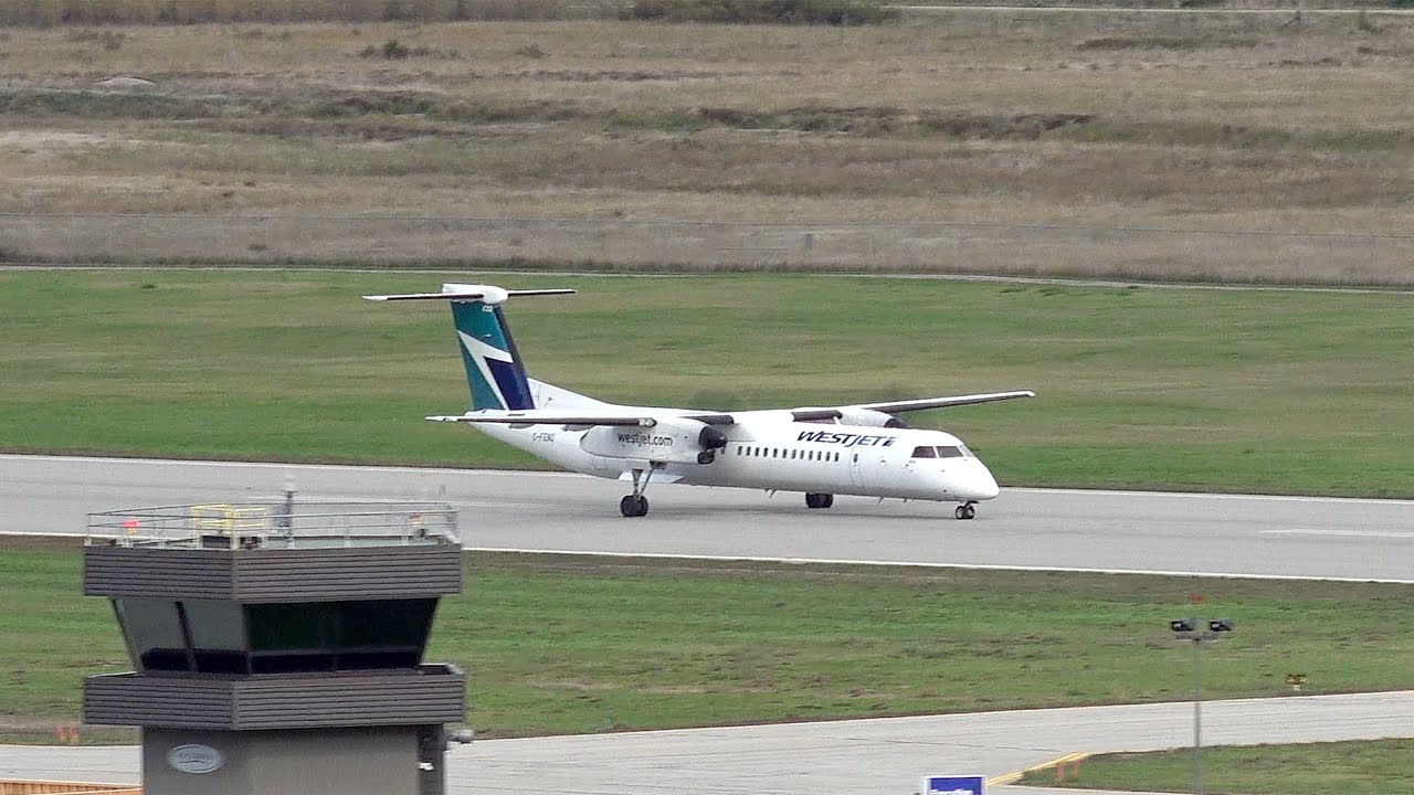 WestJet Encore Q400 landing at CYYF Airport on Windy day