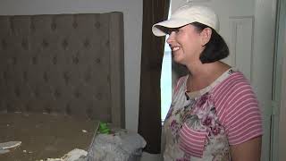 Woman tries to track down owner of neighbor's lot, after tree smashes into here home during Beryl