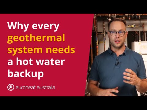 Phil from Euroheat in a geothermal plant room explaining the backup element in the hot water tank