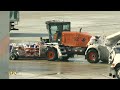 Pearson airport snowplows in action viewed from inside terminal