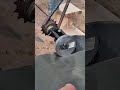 cutting a thin metal sheet using a unique handmade mechanical rolling cutter tool on a workbench