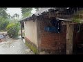 Walking in the rain exploring country side villages with small houses and huts