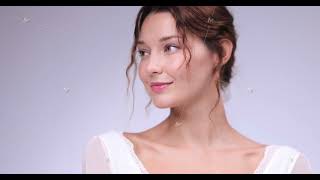 Slow Motion Beauty Footage Of Woman Turning With Soft Smile In White screenshot 3