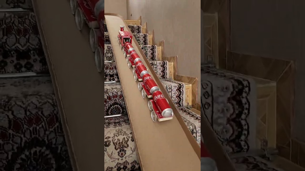 DIY Soda Can Train Drives Down Cardboard Tracks And Crashes 