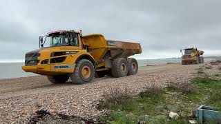 Dumper trucks on beach