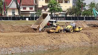 Full Processing Filling Up The Land huge, Bulldozer KOMATSU, Dump Truck unloading