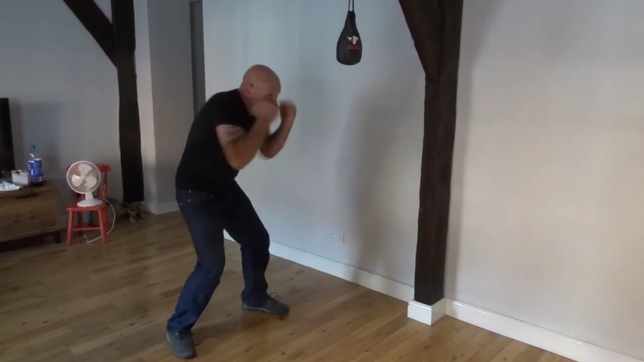 peek a boo style, jump switch  stance on a boxing  slip bag