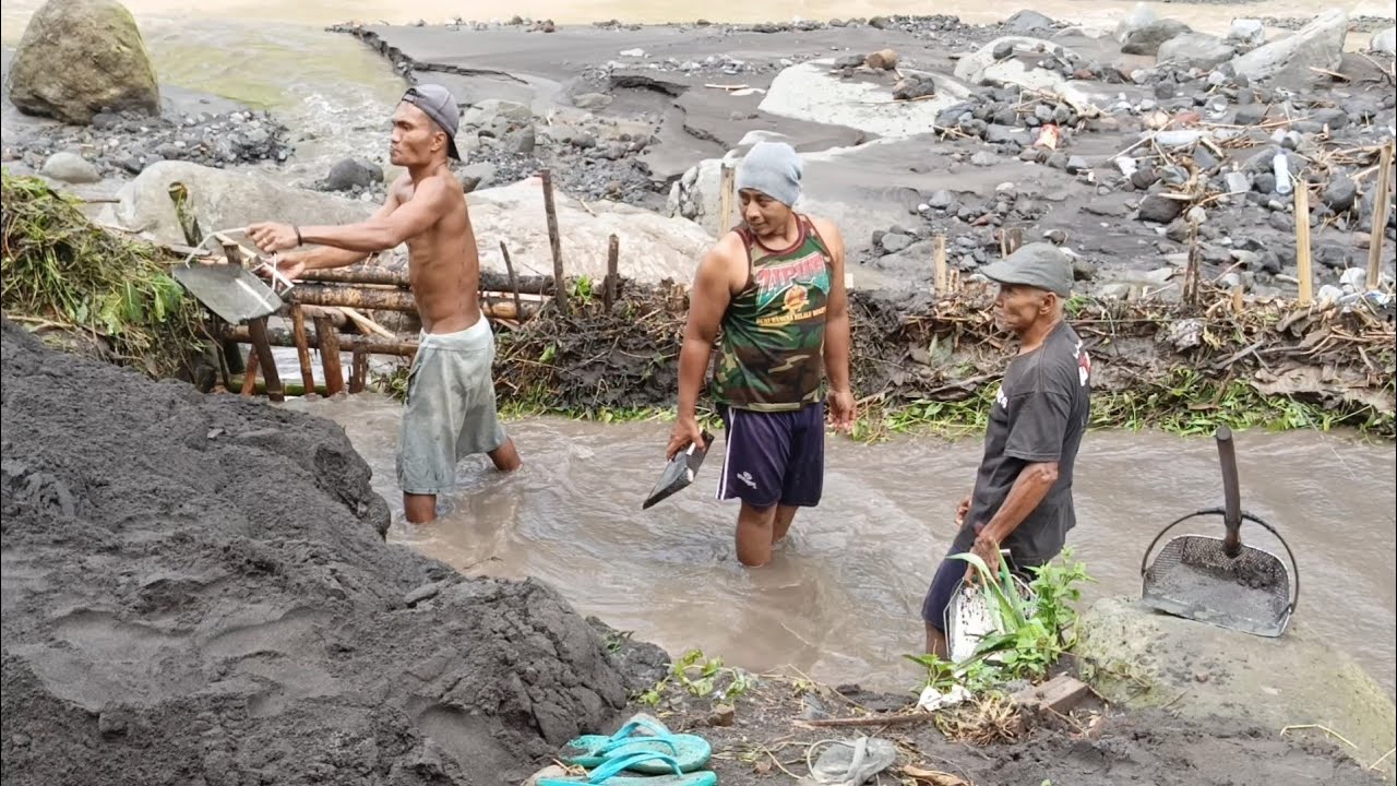 Dredging And Collection Of Black Sand By Manual Miners