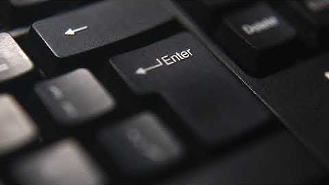 Person Pressing Enter Key of a keyboard