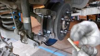 Kia Sportage замена задних колодок Kia Sportage замена задних колодок