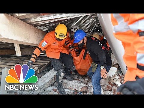 Indonesian rescue workers race to find trapped victims after deadly earthquake