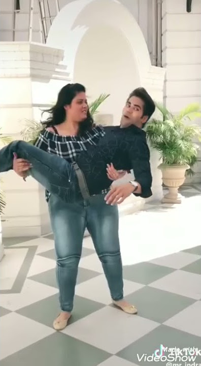 Big girl carries friend in her arms